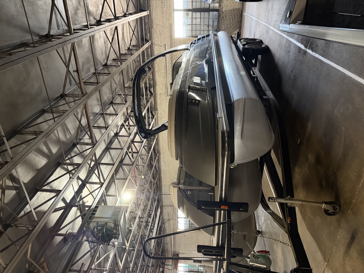 Luxury tritoon under the steel trusses
