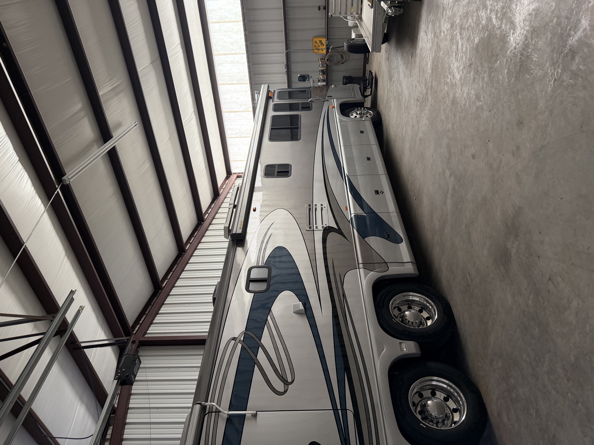 A luxury motor coach parked in its private insulated building