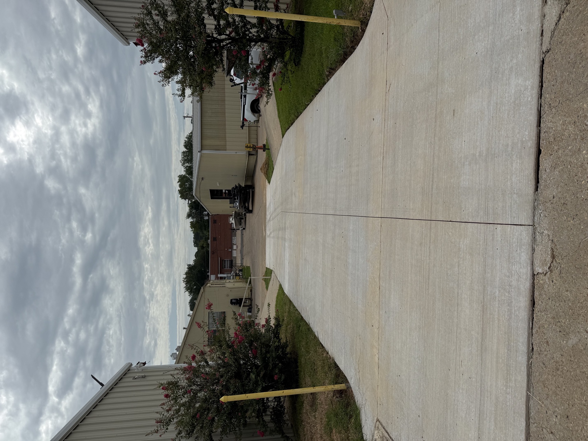 The concrete drive between storage buildings at 2502 Samford Avenue