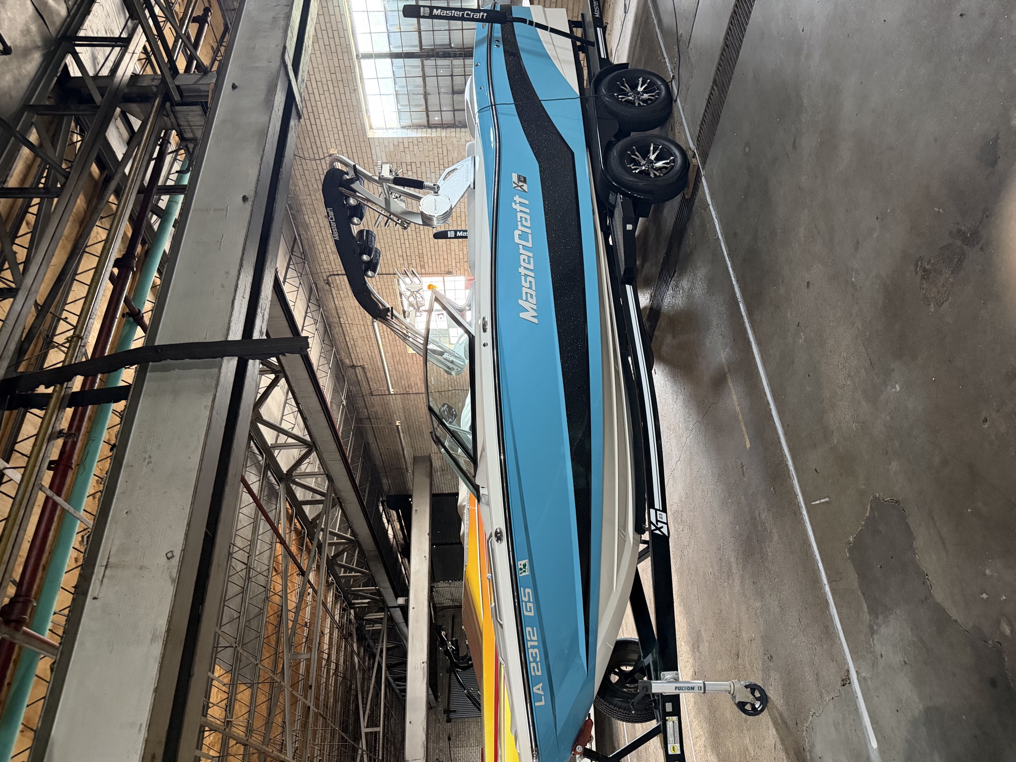A MasterCraft ski boat stored inside The Boat House's brick warehouse