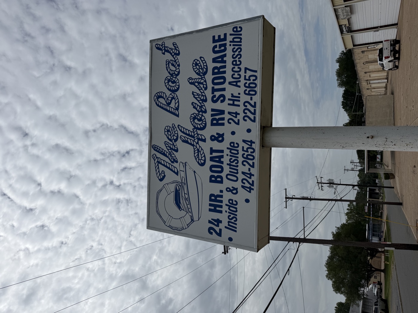 The Boat House sign on Samford Avenue — 24 hr boat and RV storage, inside and outside